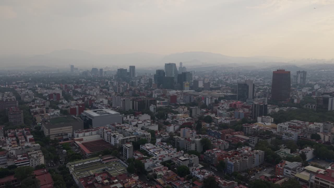 Aerial film of Mexico City on a day with an environmental alert