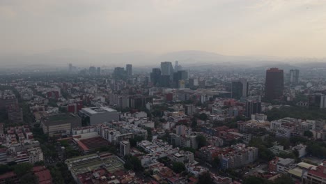 aerial film of mexico city on a day with an environmental alert