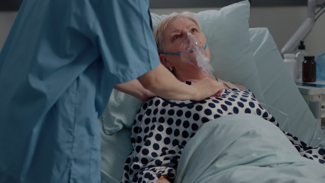 Old patient with respiratory problem getting assistance