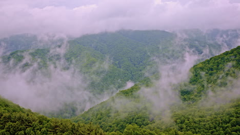 aerial cinematic view of the great smoky mountains veiled in fog and mist