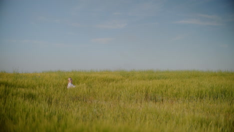 view of happy woman among tall grasses resting and relaxing