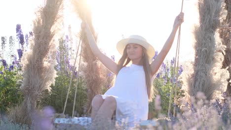 beautiful video of a young lady swinging on a swing among wildflowers photo session in the field beautiful video of a young lady swinging on a swing among wildflowers photo session in the field passion for beauty in harmony with yourself
