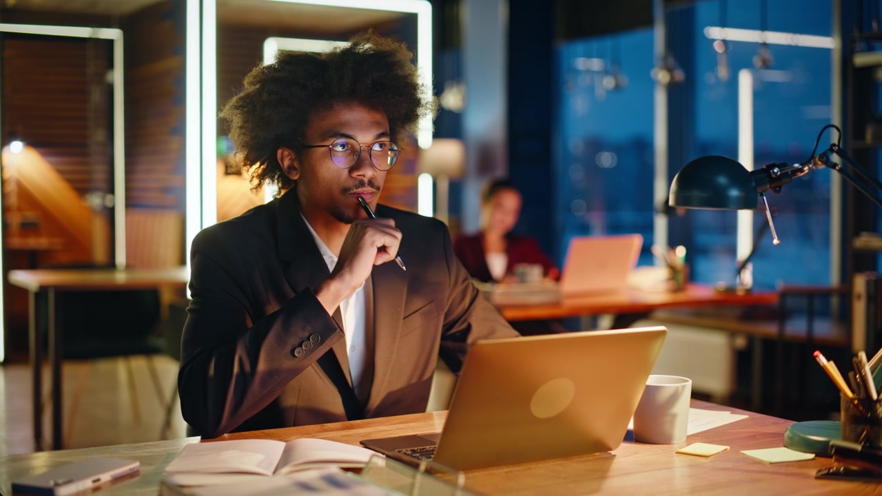 Creative entrepreneur thinking pen hand night office. Man drinking coffee desk.