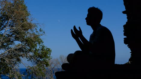 praying silhouette in the garden