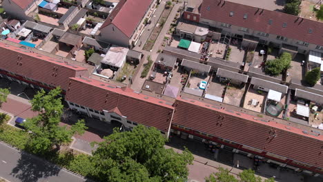 aerial birds eye overhead of a dutch neighborhood with terraced housing and big adjacent gardens