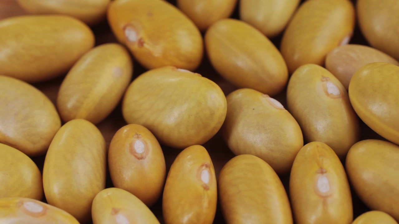 Close-up of Raw Yellow Beans on a Wooden Table