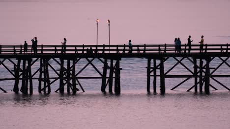 The-Mon-Bridge-is-an-old-wooden-bridge-located-in-Sangkla,-Thailand