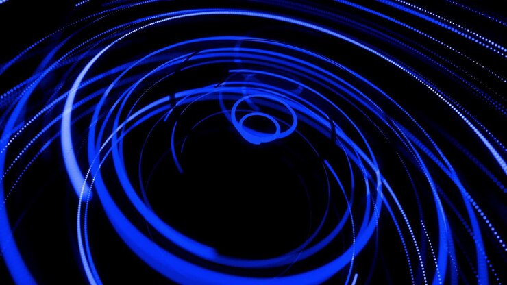 Motion design bg of flow particles shaping lines, helix and abstract structures. Blue lines swirling in spiral fly along swirling path. 3d render stylish creative abstract background in 4k.
