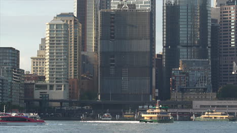 A-variety-of-ferries-moving-around-circular-quay-on-Sydney-harbour-in-Australia