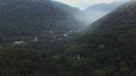 korea, songnisan cable car, follow drone shot, camera that is approaching lowering altitude