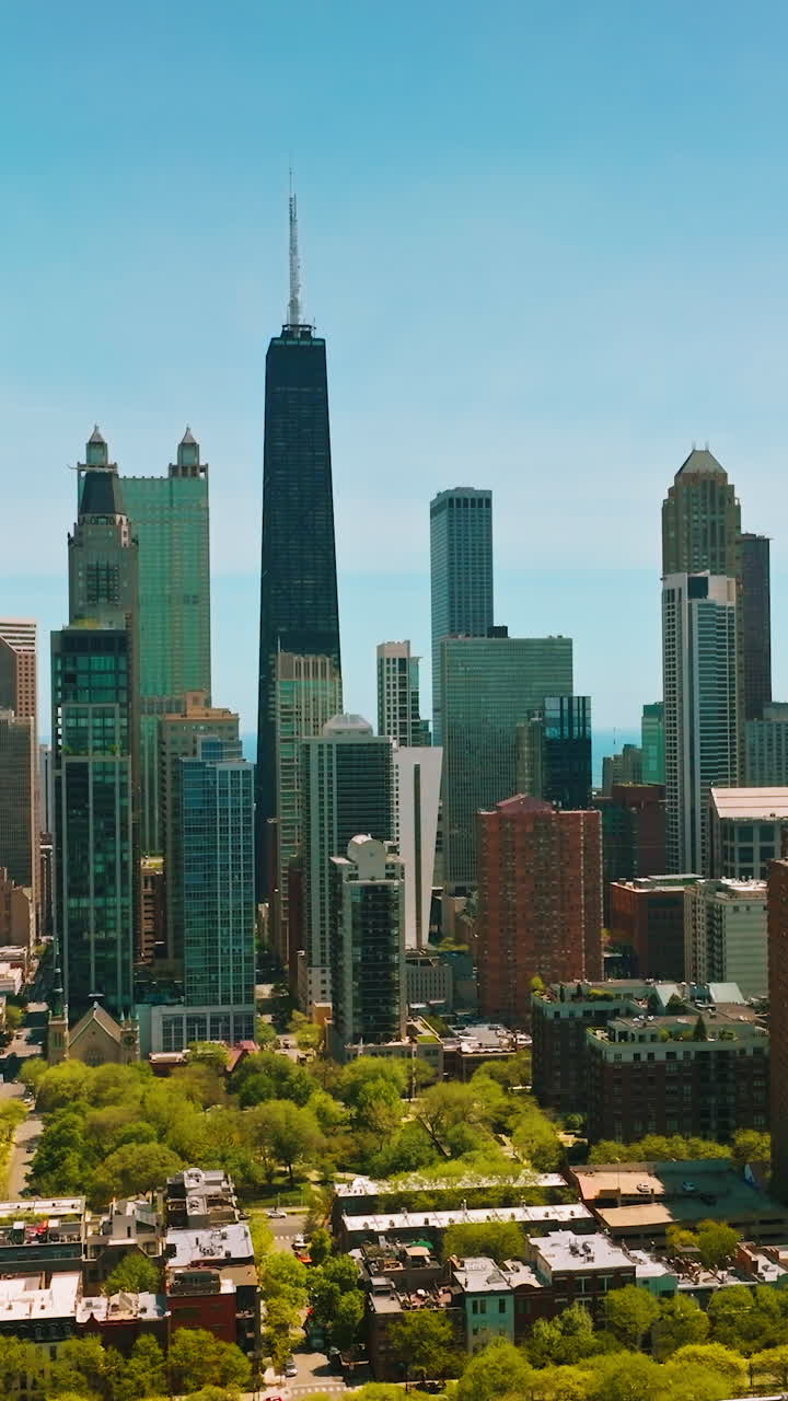 Spectacular skyscrapers of Chicago city. Amazing buildings at the backdrop of blue clear sky on sunny day. Vertical video