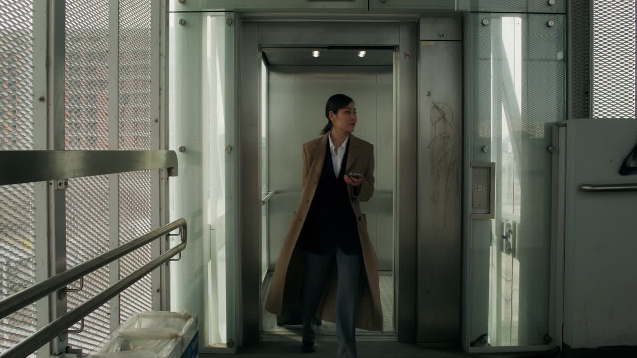 Woman Walking Into an Elevator