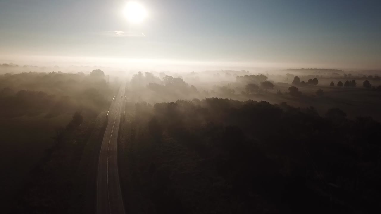 Aerial shot rising through thick fog in the Missouri Ozarks