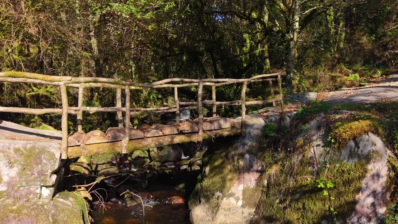 Rustic Wooden Footbridge Crossing The Fírvado River In Galicia, Spain. Aerial Close-up Shot