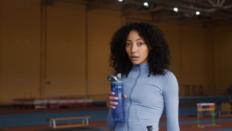 Young-woman-drinking-water