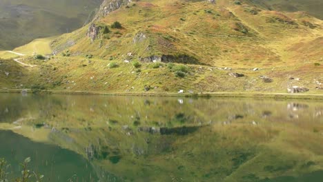 calm reflective lake pond high in the alps at dachstein austria