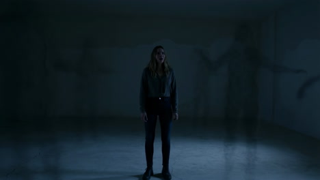 woman haunted by dark apparitions