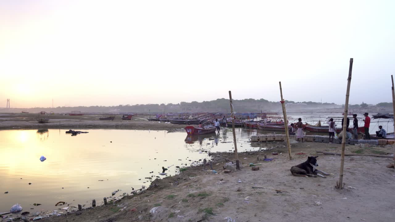 Traditional Boats and Life on the Ganges River at Sunset