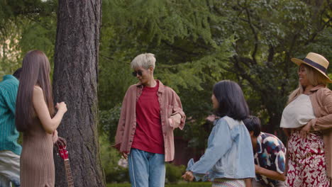 Friends-singing-and-dancing-outdoors