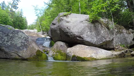 hd stationary shot maine forest wilderness stepp falls hiking trail area filled with cascades and waterfalls with large crystal clear pools of water for swimming