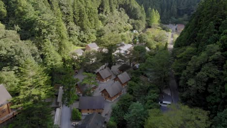 aerial view of camping village between the mountains with log houses and cabins