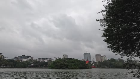 overcast weather, cityscape behind serene water