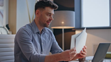 inspired creator watching sketches at modern workplace closeup. designer working