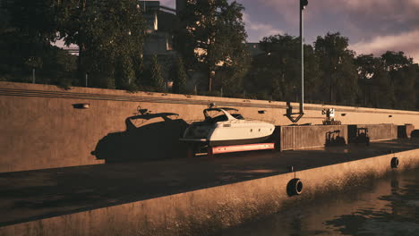 a boat docked at a marina at sunset