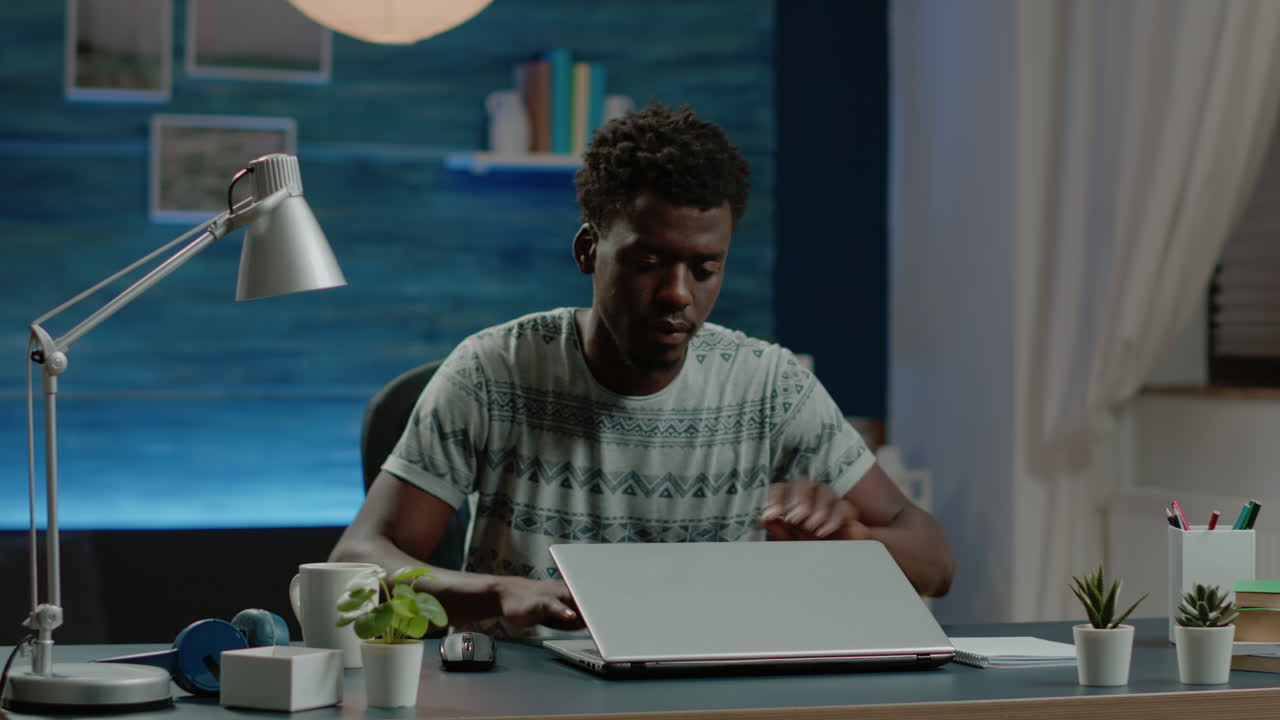 Business man working from home with laptop at desk