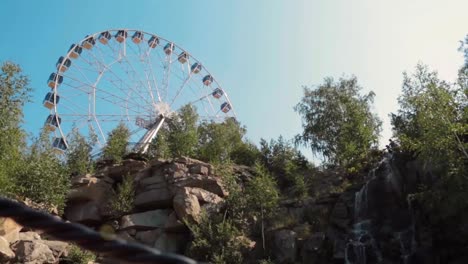 park with waterfall and ferris wheel