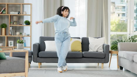 free, happy and relaxed woman dancing to music