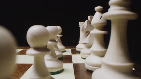 close-up of white chess pieces on a chessboard