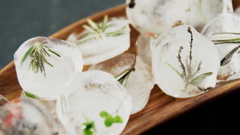 flavored ice cubes with herb in a tray 4k