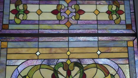wide tilt down shot of a stained glass window pane