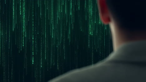 person viewing abstract green matrix code rain