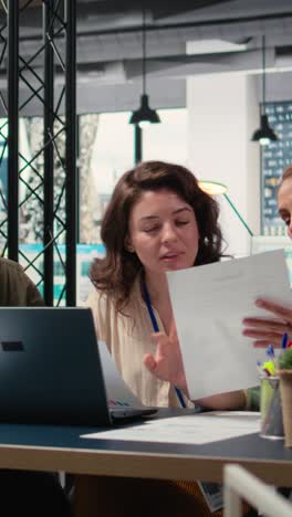 vertical video women leaders group collaborate over performance indicators