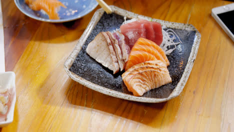 woman having sushi in restaurant 4k