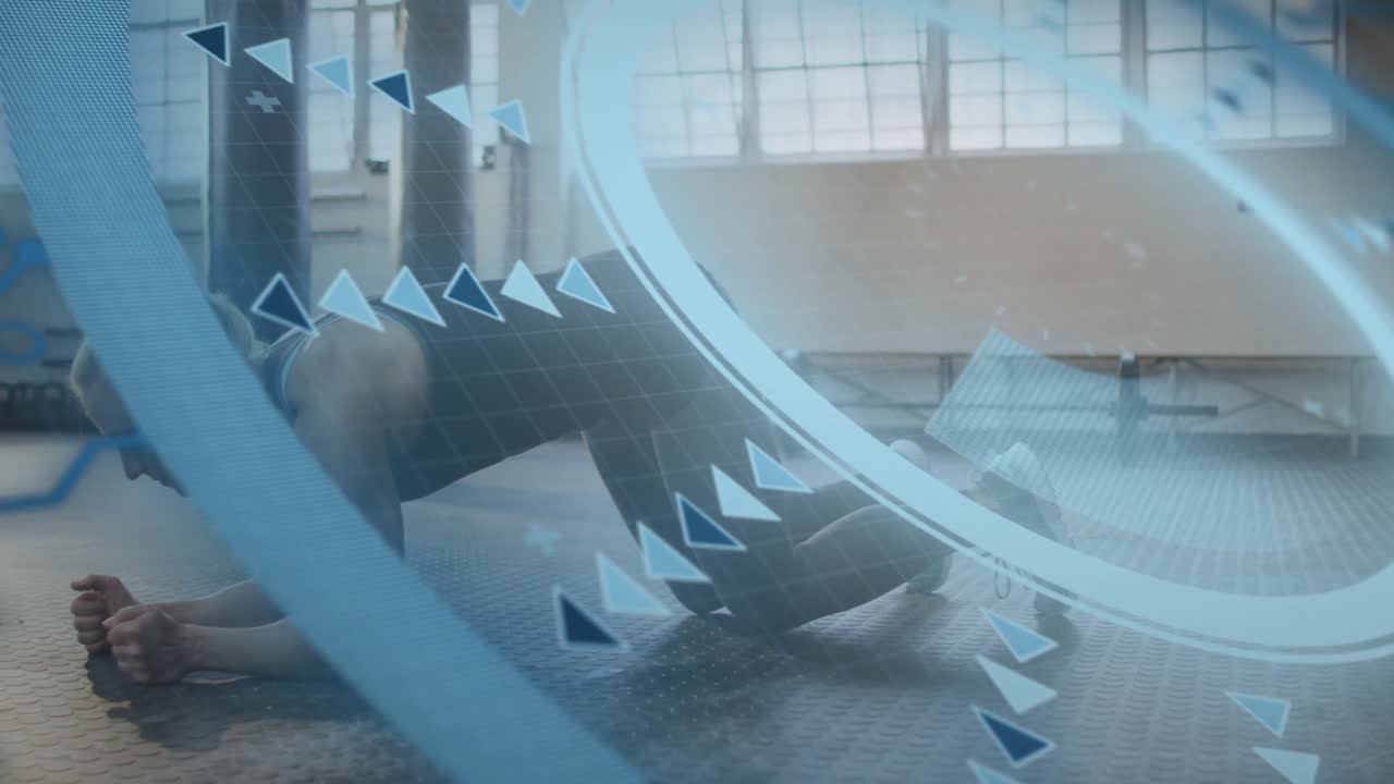 Exercising on mat, person with digital geometric animation overlay in gym