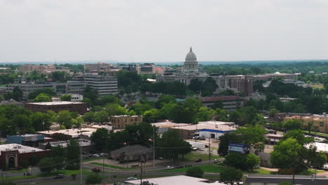 little rock city and dome of state capitol building in arkansas, usa