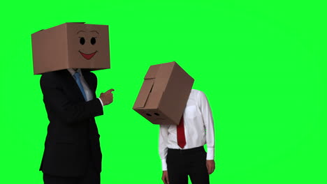 Team-of-businessman-hiding-head-with-box-