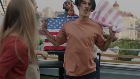 friends celebrating outdoors with american flag