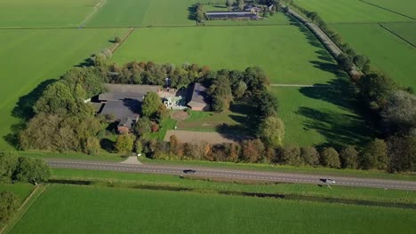 Aerial-drone-view-near-the-wind-turbine-farms-in-the-countryside-in-the-Netherlands,-Europe