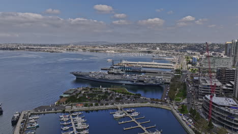 san diego california aerial v48 flyover tuna harbor capturing historical and legendary aircraft carrier uss midway museum and core-columbia downtown cityscape - shot with mavic 3 cine - september 2022