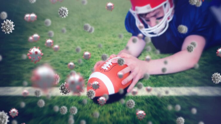 Animazione di cellule Covid-19 che cadono su un giocatore di football americano.