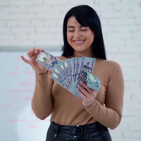 woman holding money banknotes