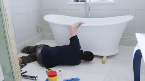 Plumber-In-Bathroom-Fitting-New-Free-Standing-Bath