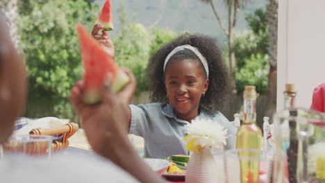 Happy-family-eating-together-at-table