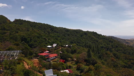 houses on the hill in bocas del toro in panama - aerial shot