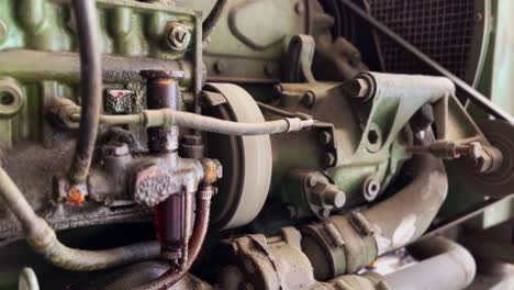 old and dirty industrial machine with oil seeping into the engine body