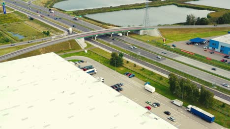 Aerial-view-of-logistics-center,-warehouses-near-the-highway